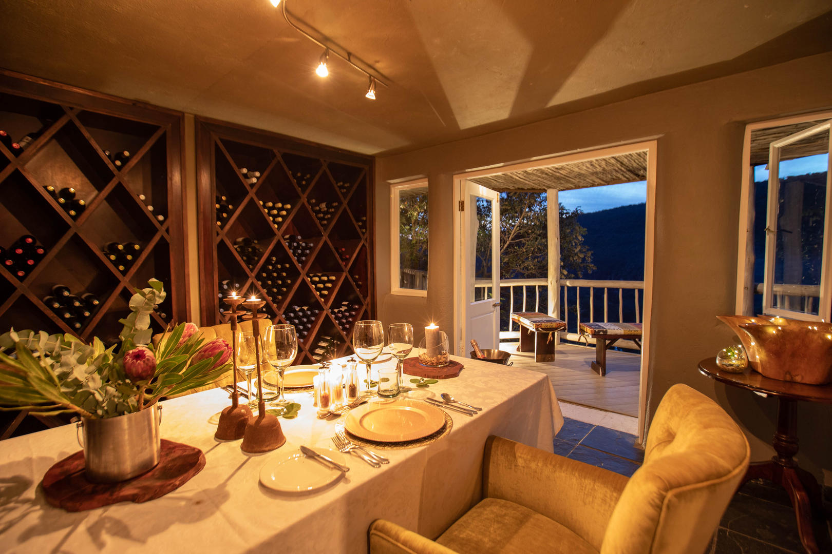 1763108781251clifftop exclusive safari hideaway wine cellar dining
